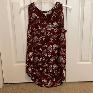 Maroon dressy tank top with grey and white flower details. Longer in the back
